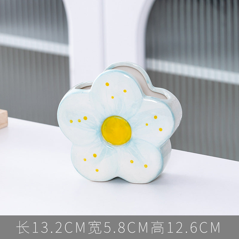 A ceramic pen holder storage ornament