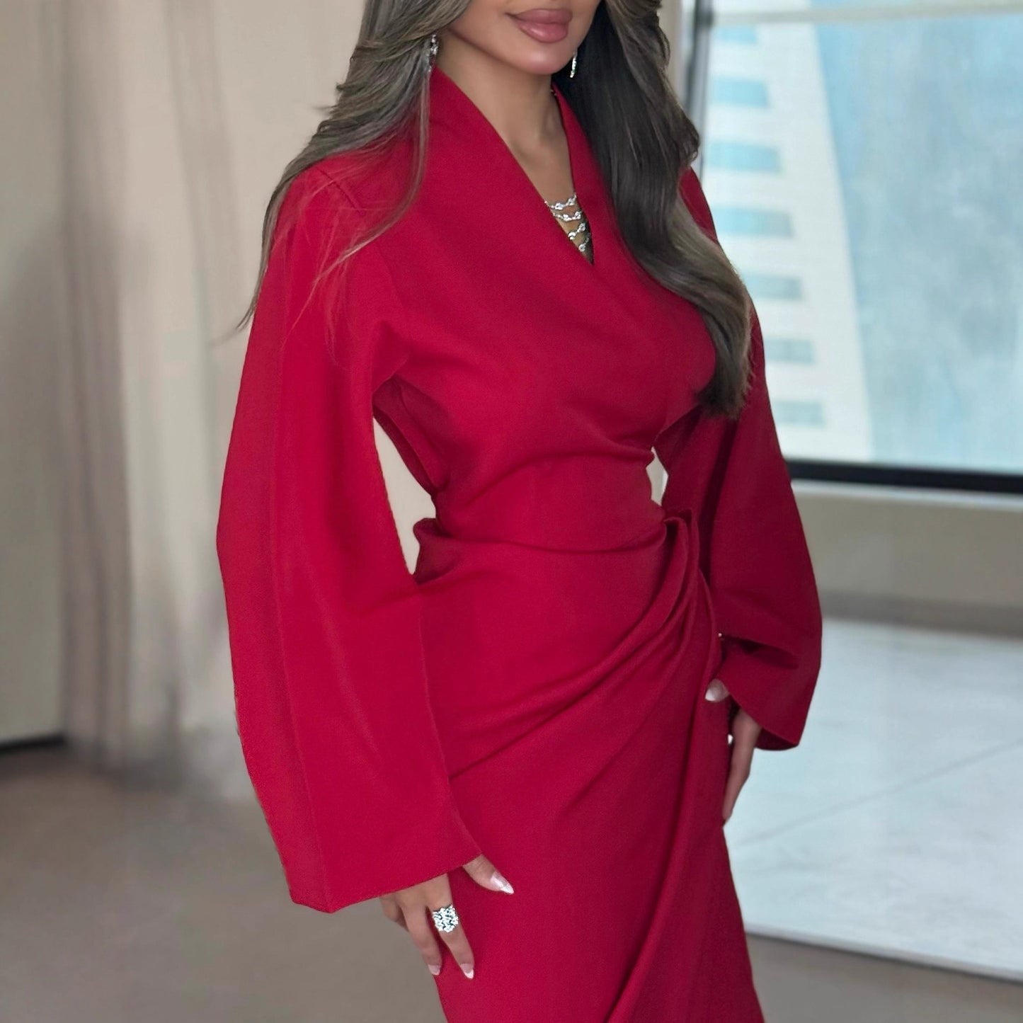 A long-sleeved V-neck dress