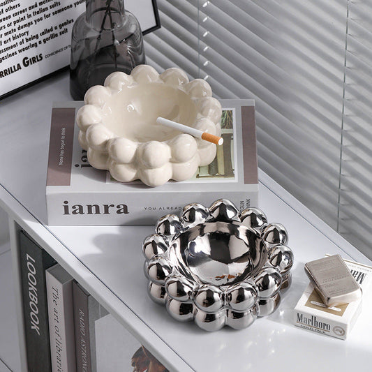 A ceramic tissue box ashtray