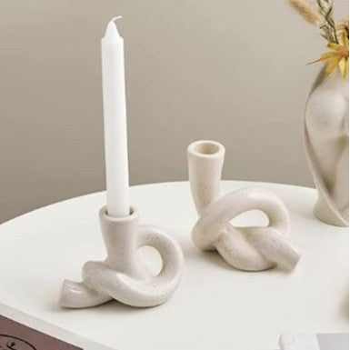 A ceramic candle holder ornament
