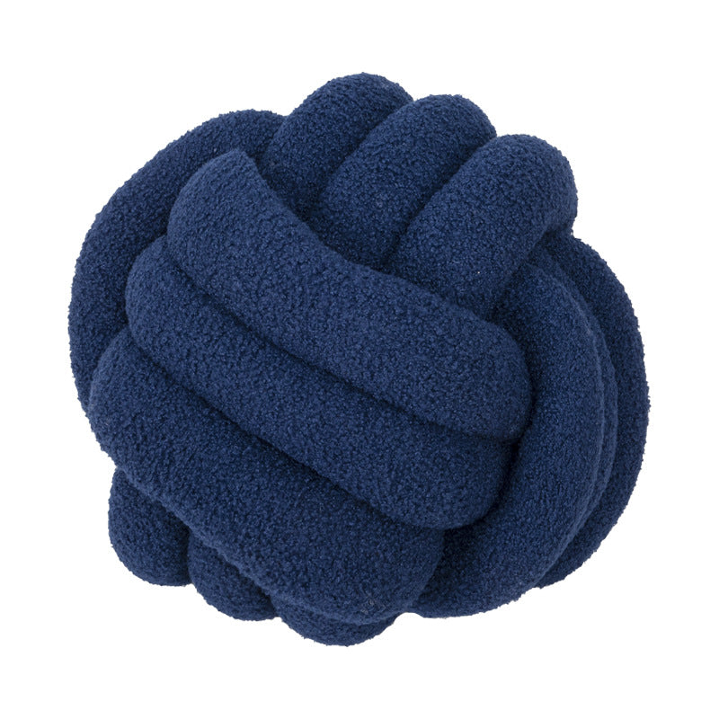 A braided knotted ball pillow