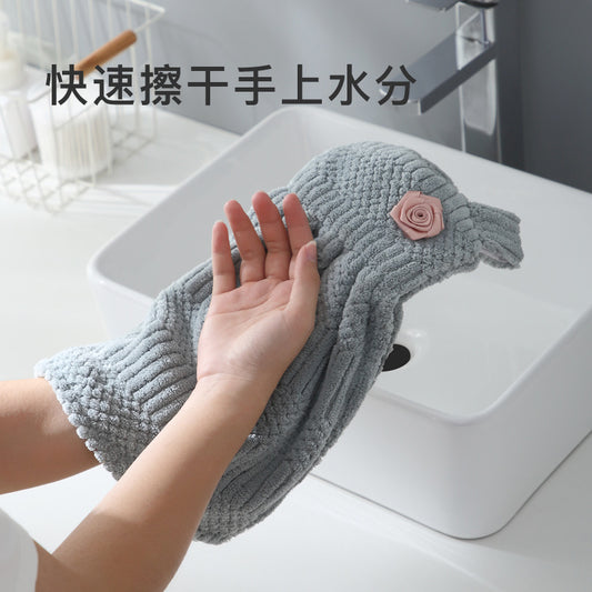 A coral fleece hand towel