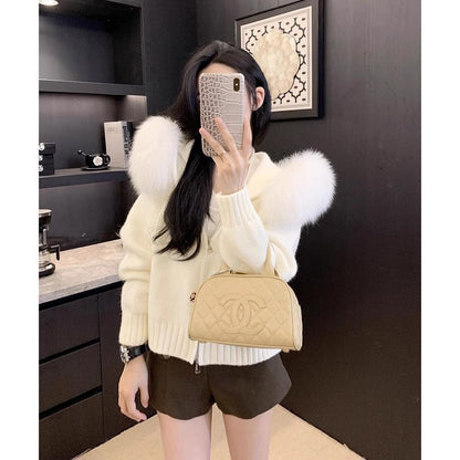A fur collar knitted hooded sweater cardigan