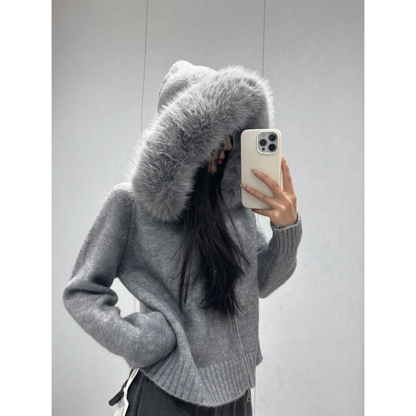 A fur collar knitted hooded sweater cardigan
