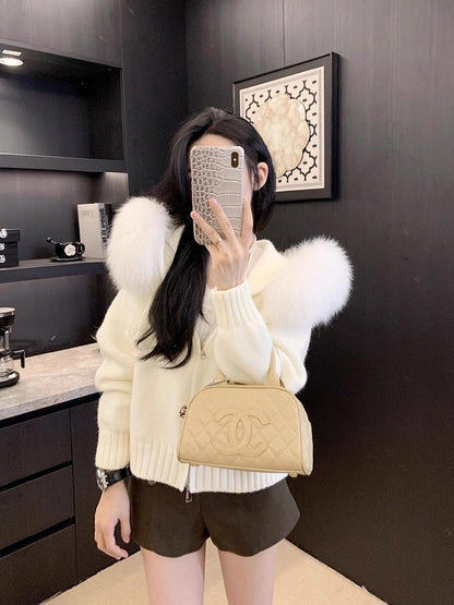 A fur collar knitted hooded sweater cardigan