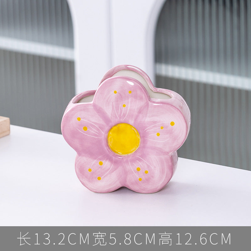 A ceramic pen holder storage ornament