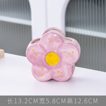 A ceramic pen holder storage ornament