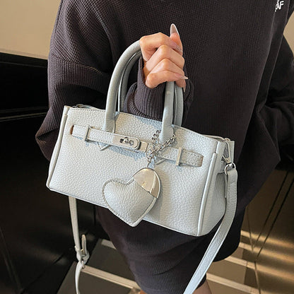 A heart-shaped pendant handbag