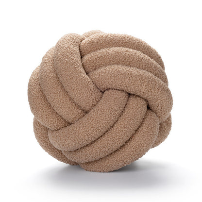 A braided knotted ball pillow
