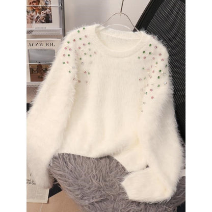 A diamond-encrusted fluffy top sweater