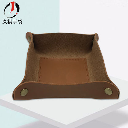 A leather storage tray