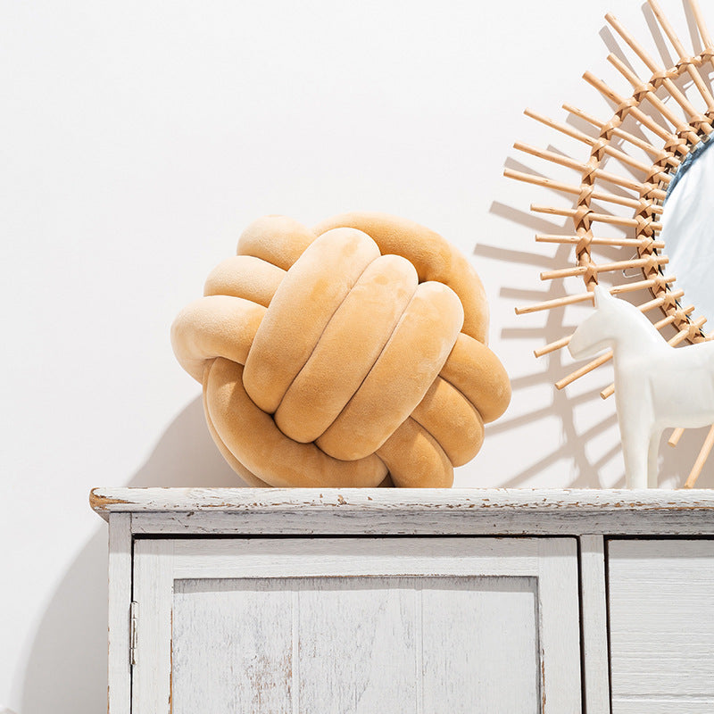 A braided ball pillow