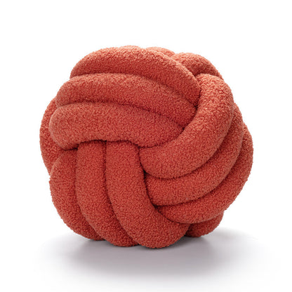 A braided knotted ball pillow