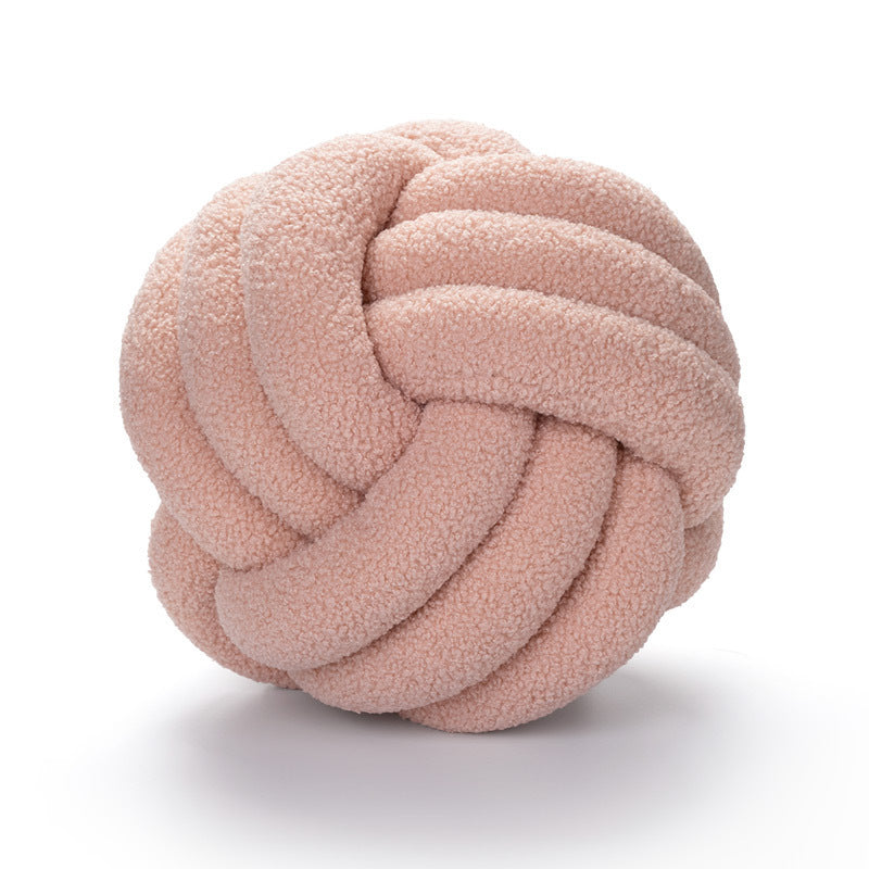 A braided knotted ball pillow