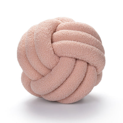 A braided knotted ball pillow
