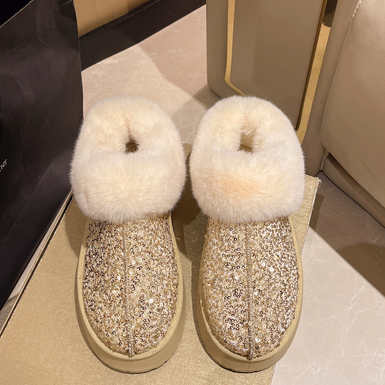 A plush sequined snow boot