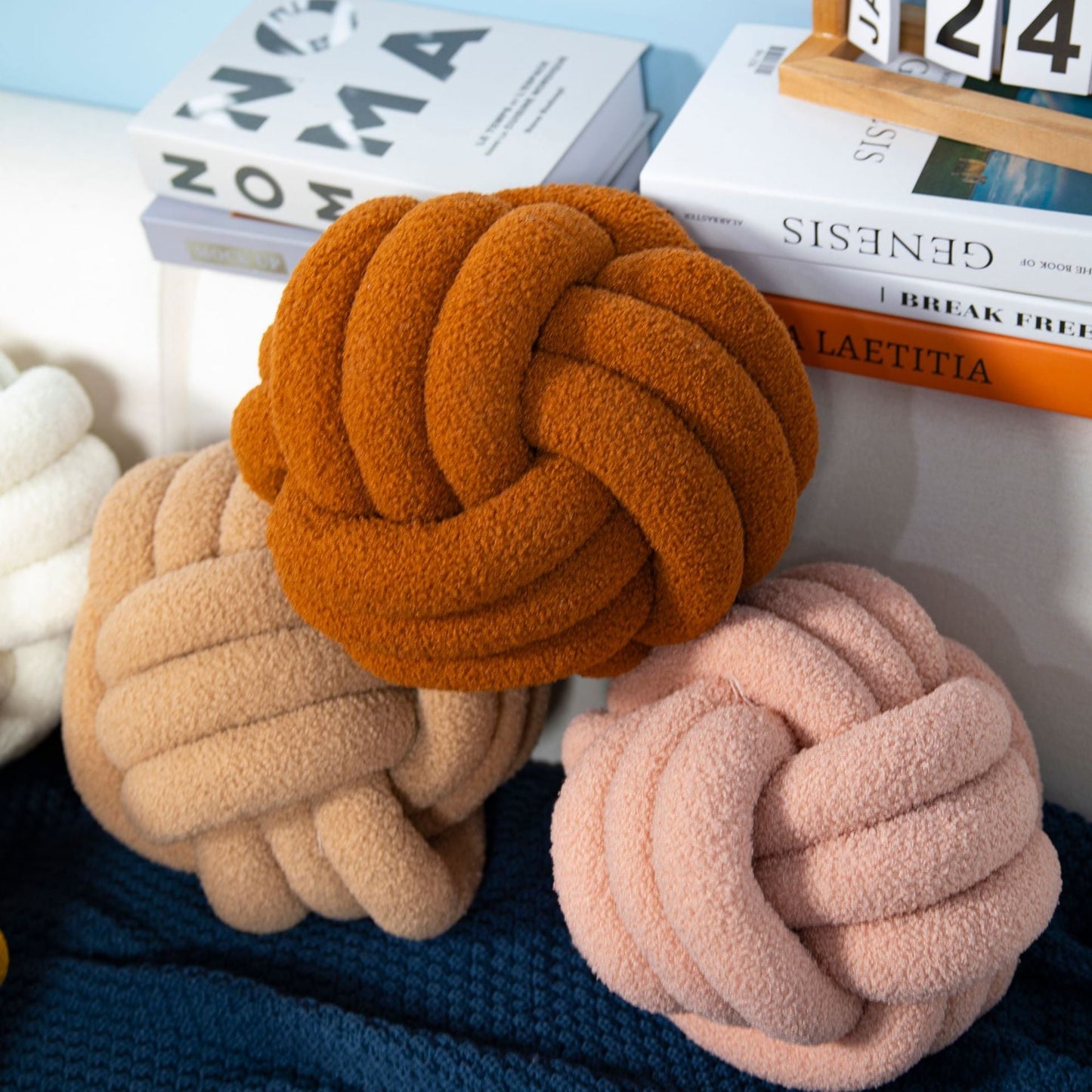 A braided knotted ball pillow