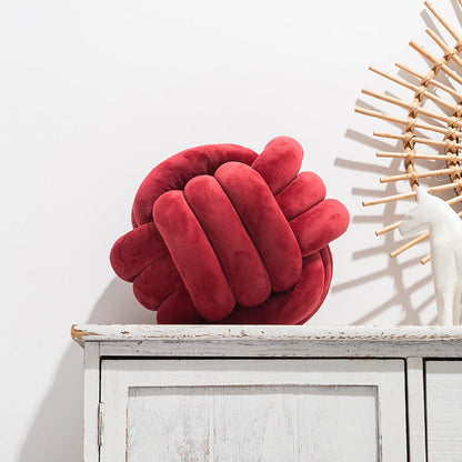 A braided ball pillow