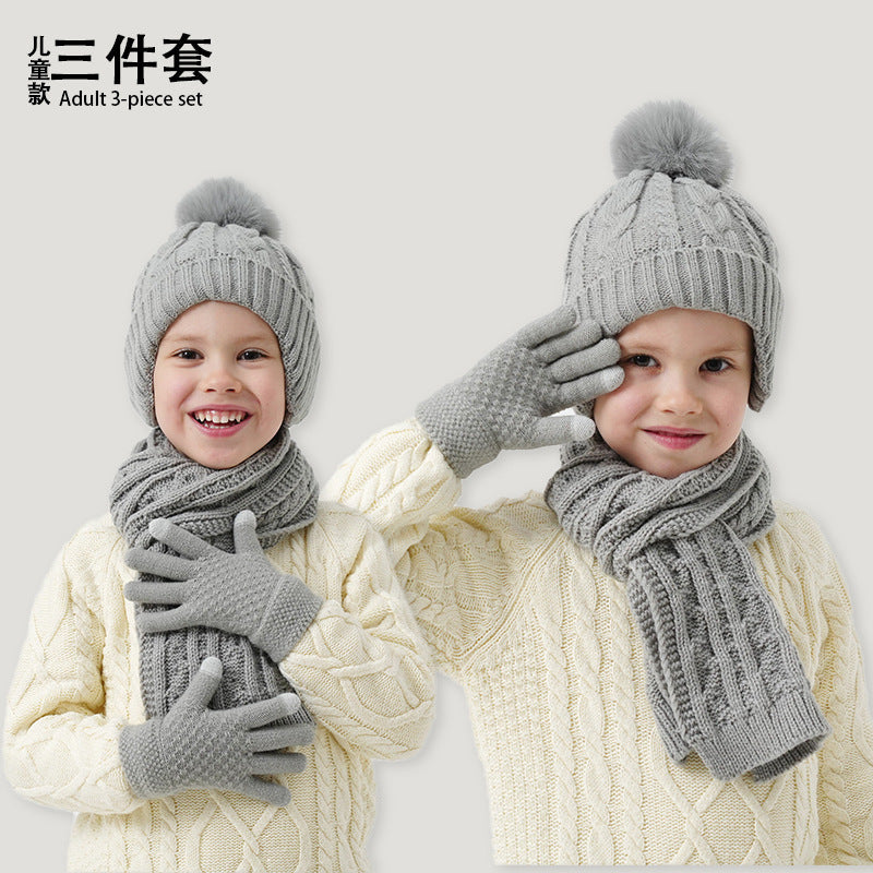 A children's hats, scarves and gloves three-piece set wool inside