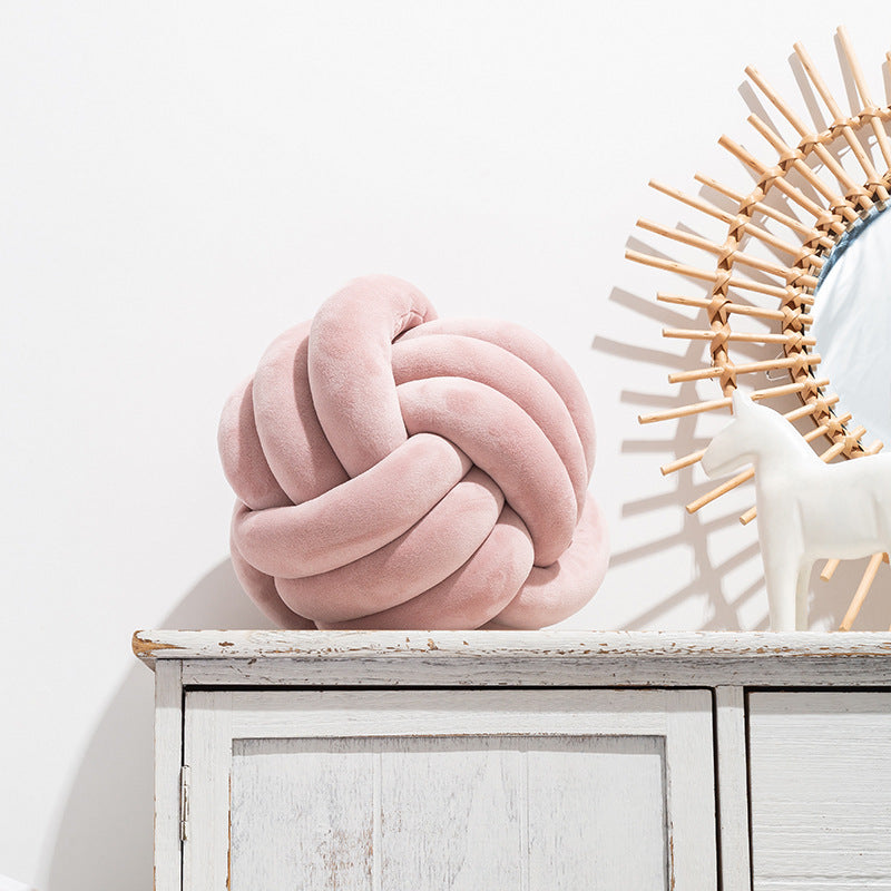 A braided ball pillow