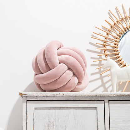 A braided ball pillow