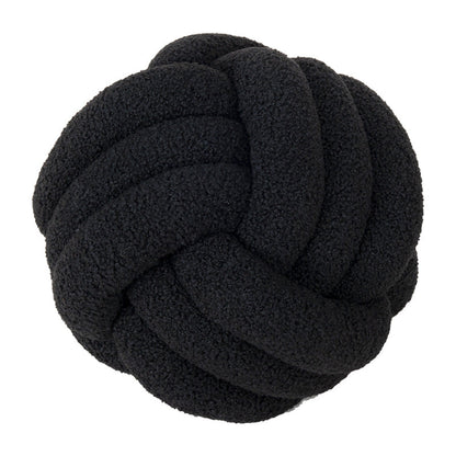 A braided knotted ball pillow
