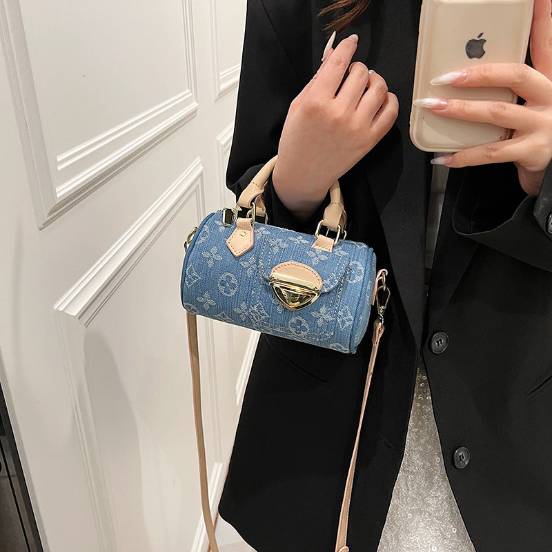 A denim bag cylinder bag