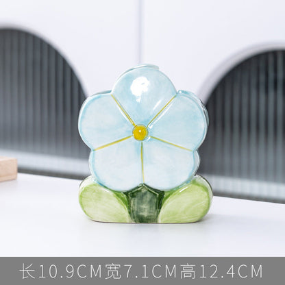 A ceramic pen holder storage ornament