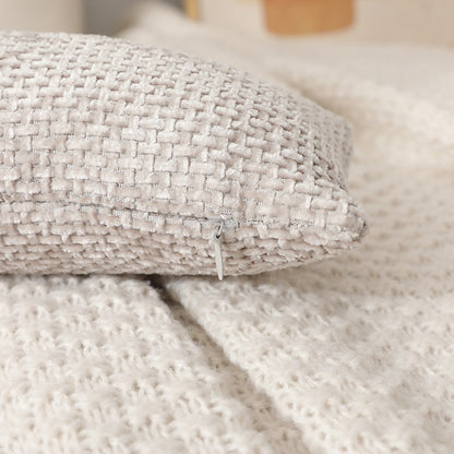 A knotted pillow throw pillow