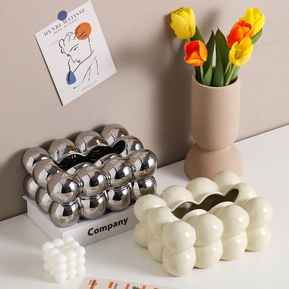 A ceramic tissue box ashtray