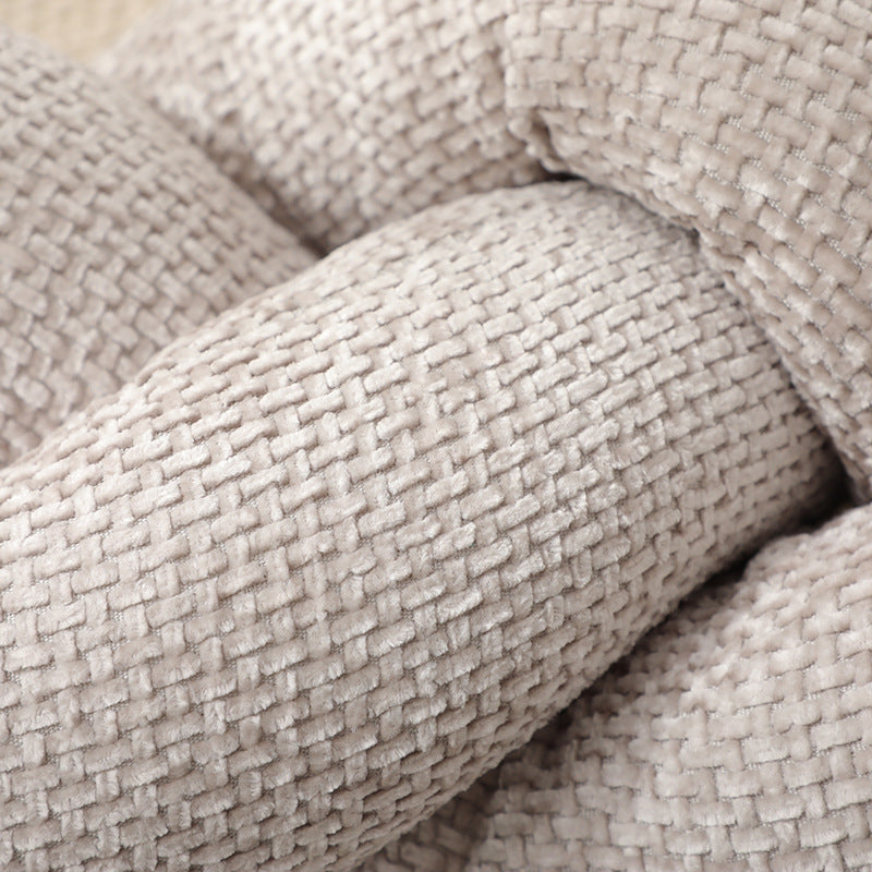 A knotted pillow throw pillow