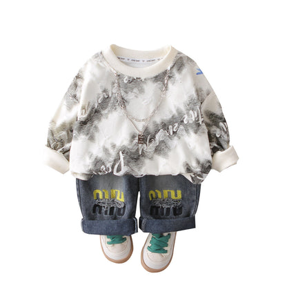 A children's sweater jeans set