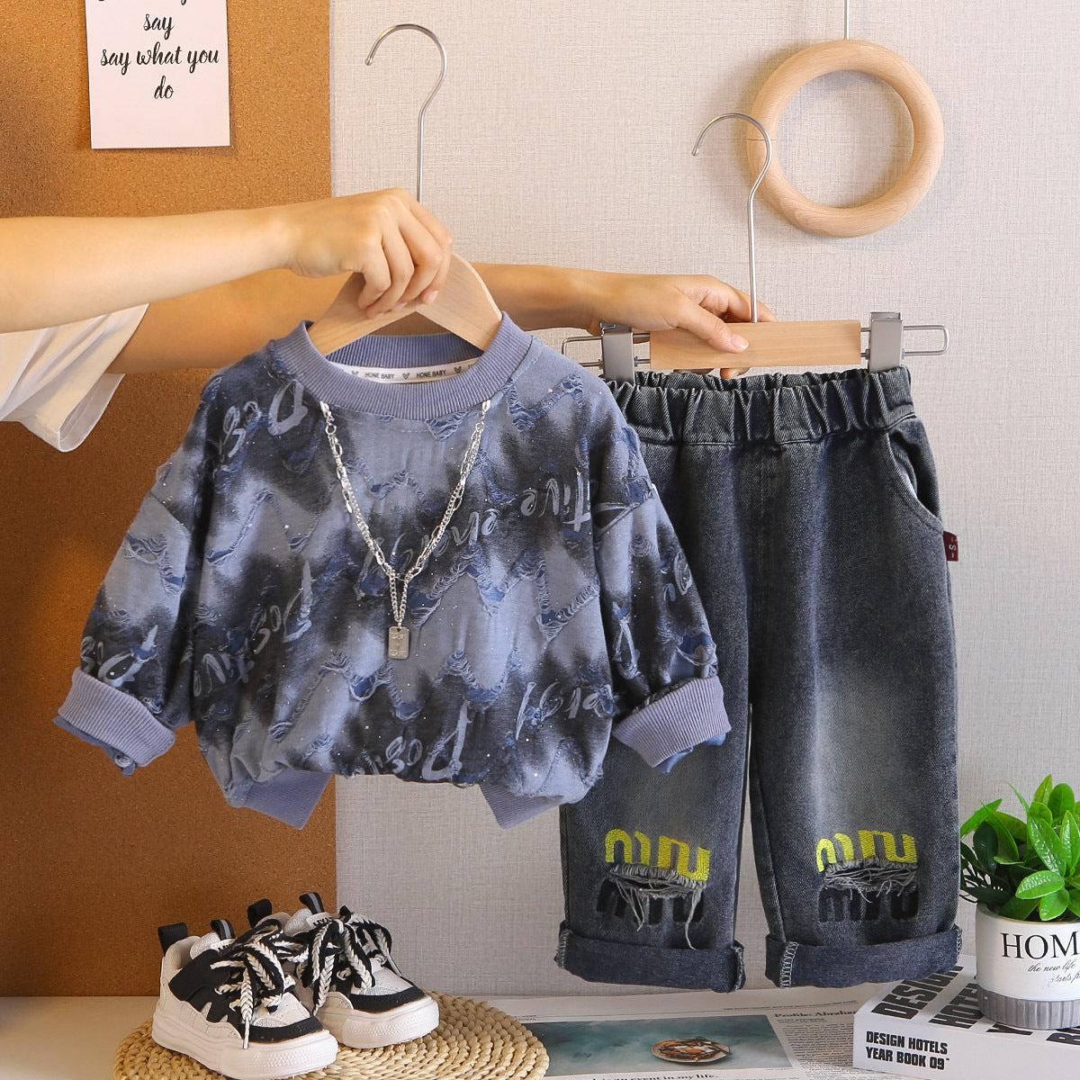 A children's sweater jeans set