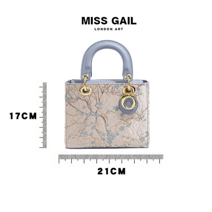 A embroidered shoulder bag messenger bag