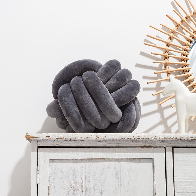 A braided ball pillow