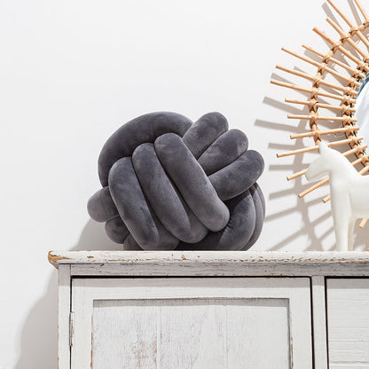 A braided ball pillow