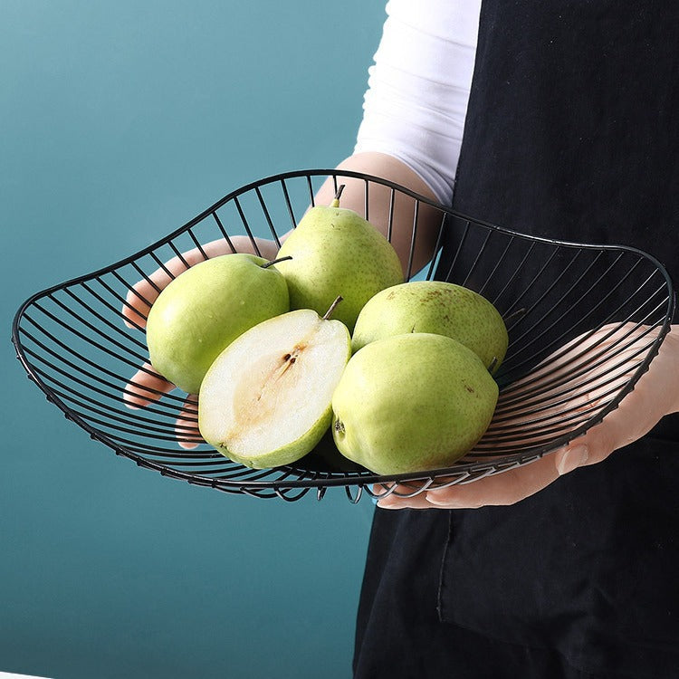 A fruit basket wrought iron storage basket