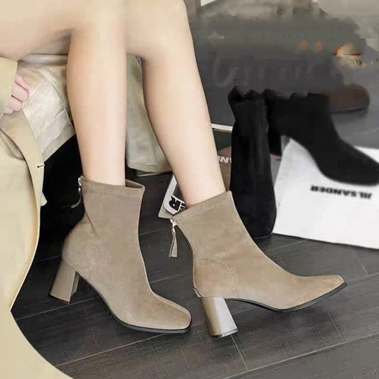 A suede zipper boot