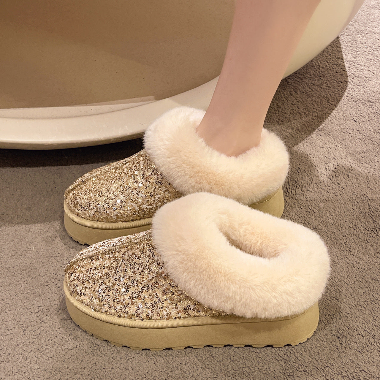 A plush sequined snow boot