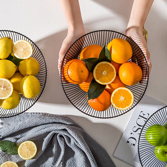 A wrought iron snack pot fruit plate storage