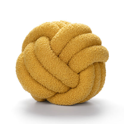 A braided knotted ball pillow