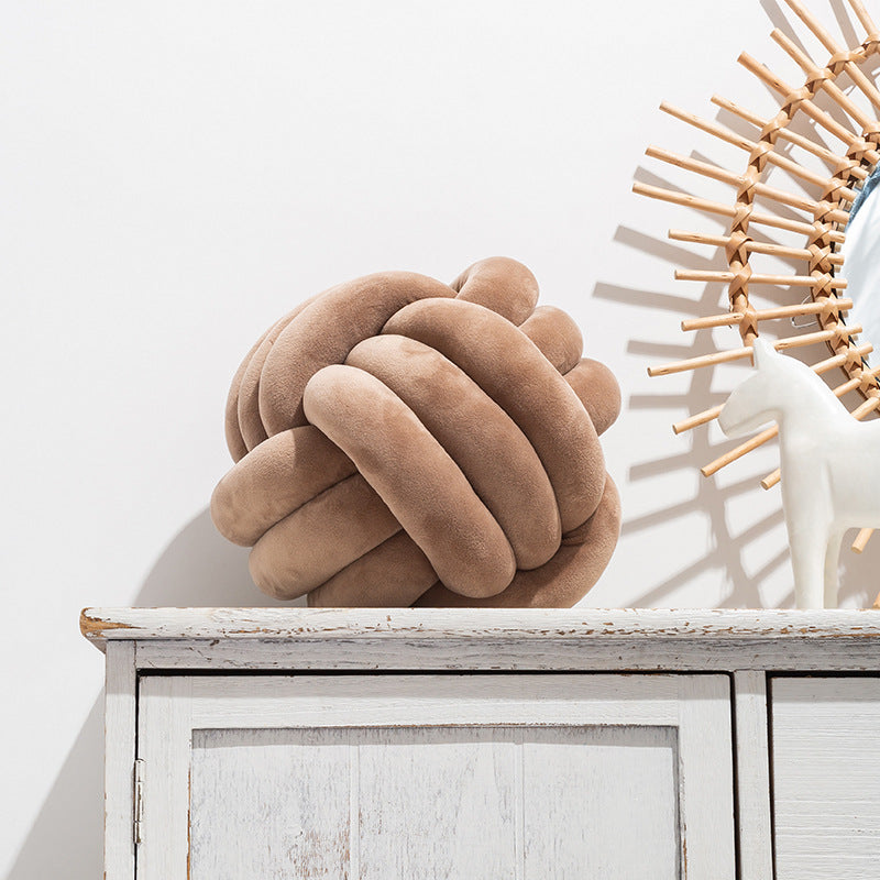 A braided ball pillow