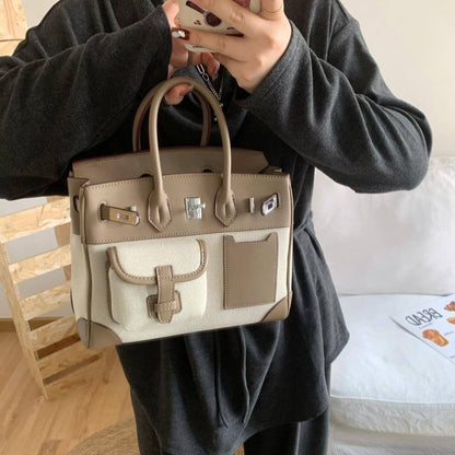 A spring new contrasting color canvas leather pocket platinum bag versatile casual shoulder oblique span women's bag