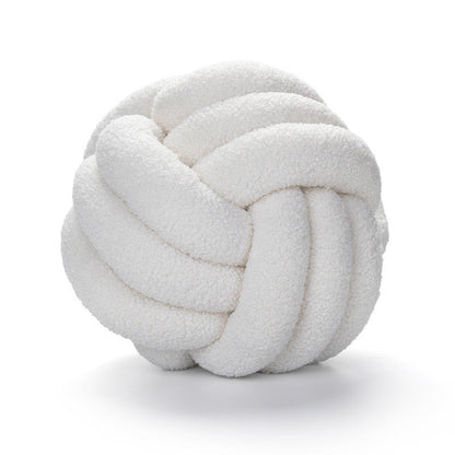 A braided knotted ball pillow