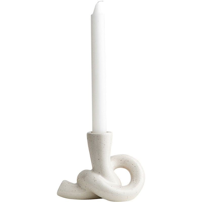 A ceramic candle holder ornament