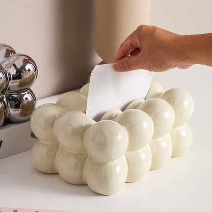 A ceramic tissue box ashtray