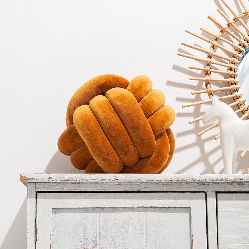 A braided ball pillow