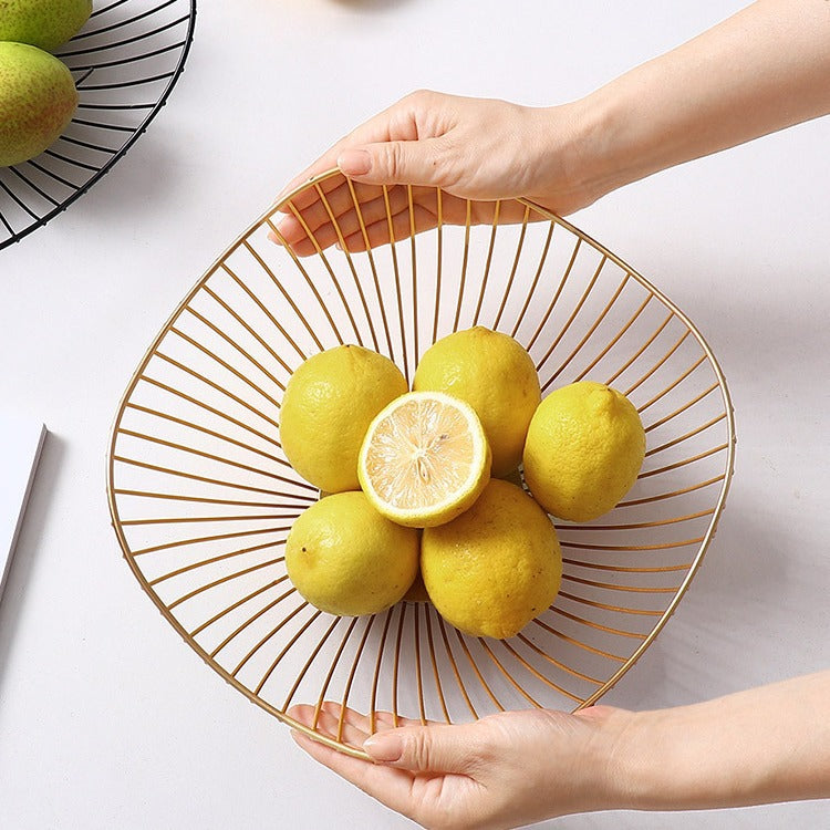 A fruit basket wrought iron storage basket