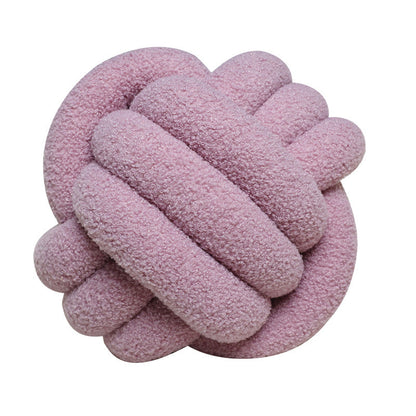 A braided knotted ball pillow