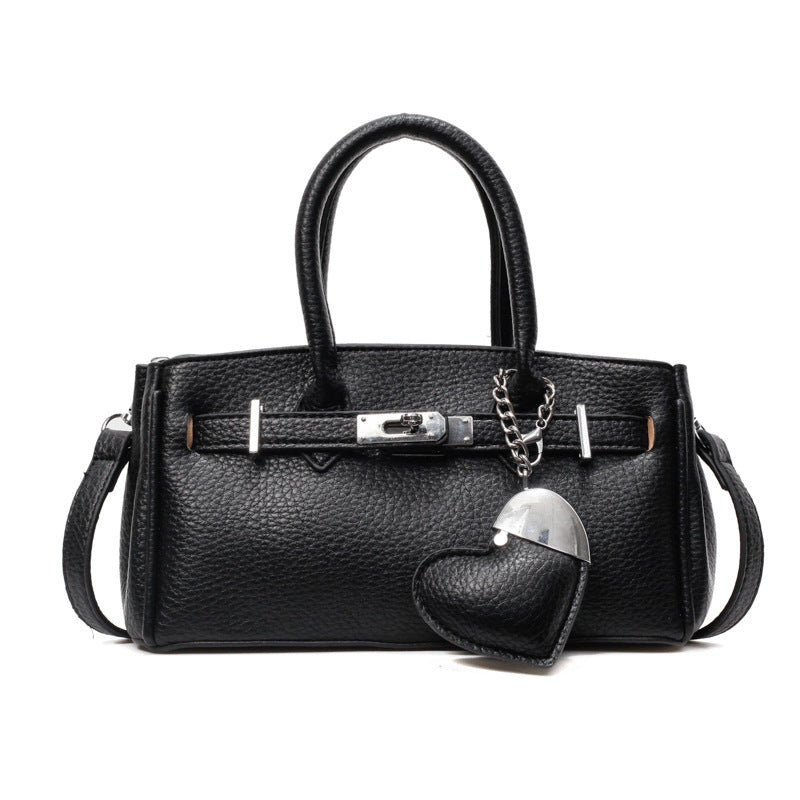 A heart-shaped pendant handbag